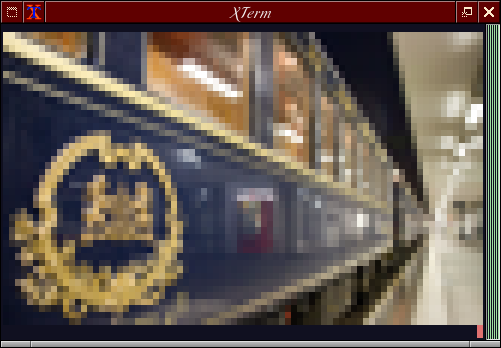 Capture d'écran d'un terminal GNU/Linux (un X-Term, précisément) affichant l'image sus-mentionnée de l'Orient Express, avec toutes ses couleurs, avec une précision au demi-caractère.